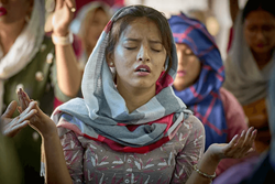 A woman prays during worship at Hebron United Methodist Church in Lalitpur, Nepal, on May 20. Christians comprise only about 1.4 percent of Nepal’s 30 million people. Over 80 percent of the population is Hindu. The remainder are mostly Buddhist and Muslim. Photo by Paul Jeffrey, UM News.