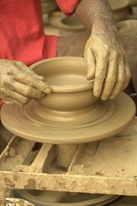 A potter's wheel illustrates how God continues to mold us. 