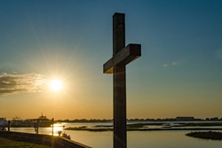 The sun rises behind the seawall cross at Belin United Methodist Church in Murrells Inlet, South Carolina. Photo by Austin Bond Photography