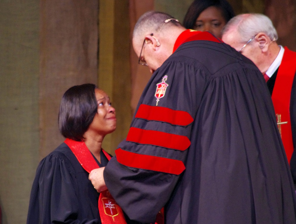 Bishop Sharma Lewis shares a moment with Bishop Lindsey Davis, her former bishop in North Georgia Conference, during her consecration on July 15, 2016, at Lake Junaluska Conference and Retreat Center at Lake Junaluska, N. C. File photo by Burt Williams, Western North Carolina Conference.