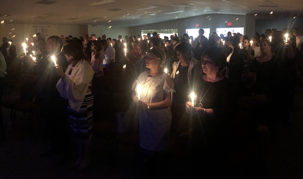 Close to 200 people gather for a candlelight vigil Jan. 24 at Nuevo Pacto United Methodist Church in Sebring, Fla., in memory of Marisol Lopez. Photo by Juan A. Maldonado for UMNS.