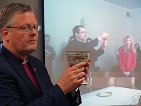 Bishop Christian Alsted of Northern Central Europe celebrated communion with a congregation in Huntsville, Alabama, as the Rev. Remigijus Matulaitis celebrated with a congregation in Lithuania as part of the In Mission Together Lithuania 50/50 Partnership Summit in June 2015. Each congregation was able to see the other over the internet. Photo courtesy of the Rev. Patrick Friday, In Mission Together. 