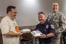 A member of Coraopolis United Methodist Church delivers Thanksgiving meals to paramedics and members of the military who work on Thanksgiving day.