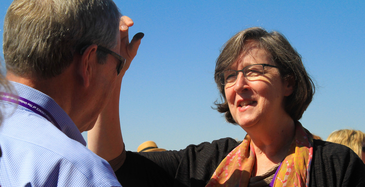 Bishop Elaine Stanovsky gives ashes to a visitor to the Sand Creek Massacre National Historic Site as part of an act of repentance held on June 20, 2014. File photo by Ginny Underwood.