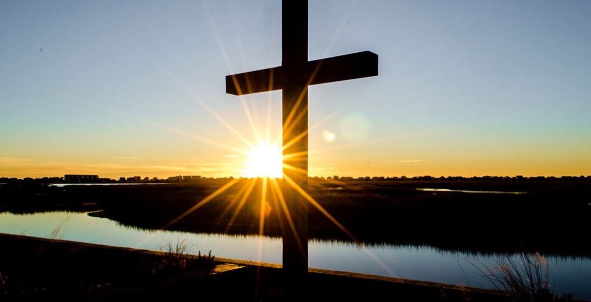 Sunrise behind the cross at Belin Memorial United Methodist Church in Murrells Inlet, South Carolina by Austin Bond Photography.