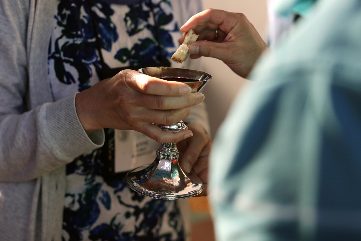 Eucharist is shared during the morning prayer held in the chapel of Sarum College during the 2016 Wesley Pilgrimage in England. Photo by Kathleen Barry, United Methodist Communications.