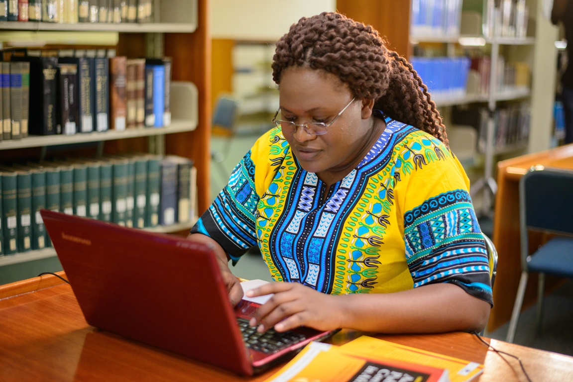  A student works on a computer in the library on the campus of Africa University in Mutare, Zimbabwe. Photo courtesy of Africa University.