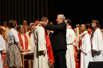 The Rev. Jon Van Dop received an elder stole from a mentor during an ordination service. Photo courtesy of the Rev. Jon Van Dop.