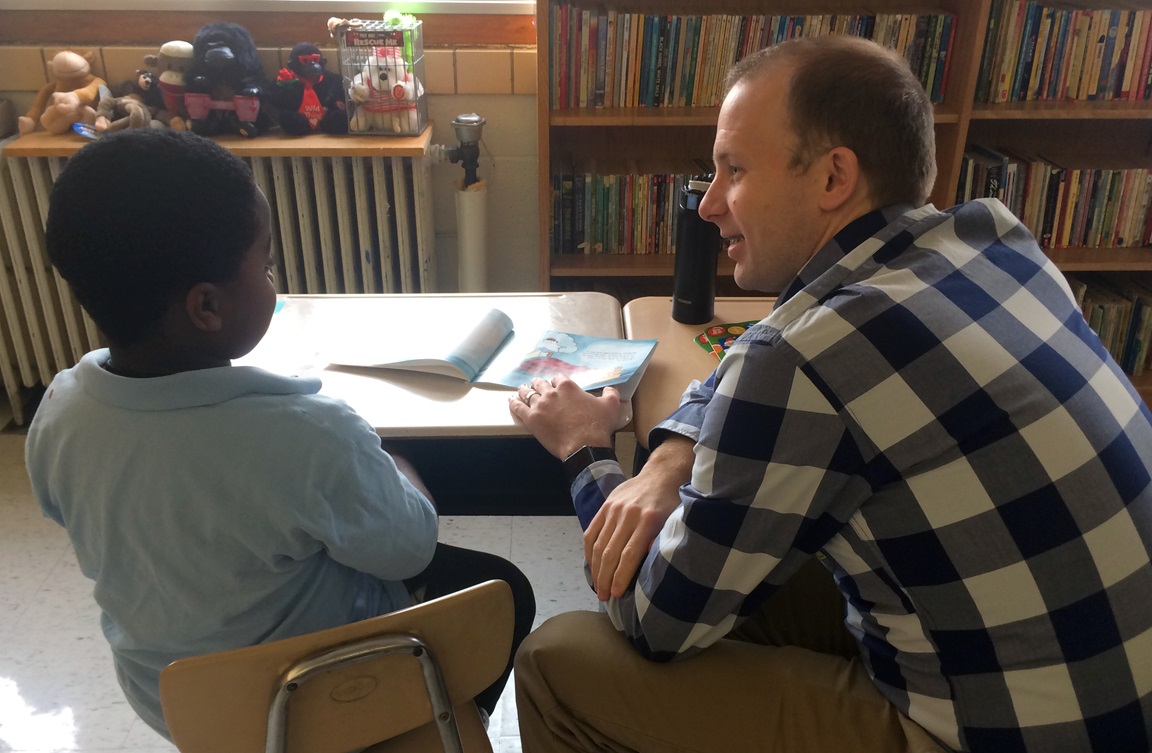 A member of The Gathering United Methodist Church in St. Louis works with a student at Washington Elementary School as part of the church's Literacy Project. Photo courtesy of The Gathering. 