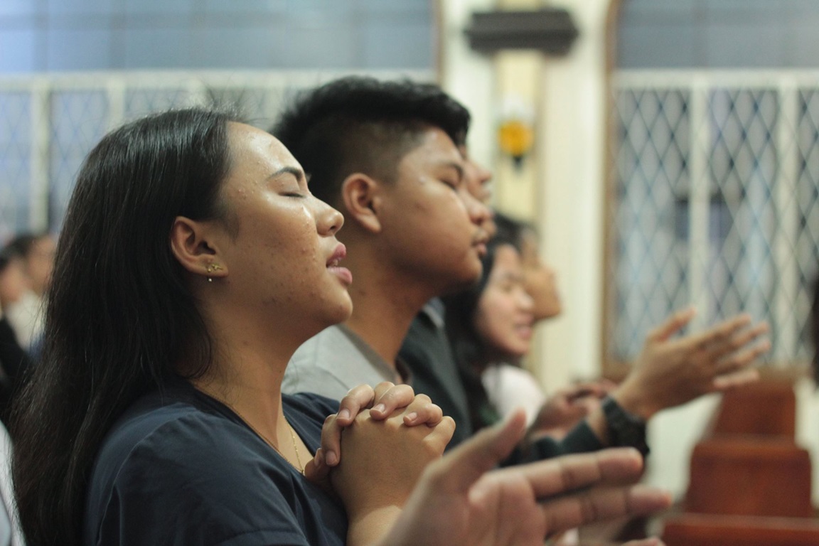 Young people worship at First United Methodist Church in Baguio City, Philippines. The church has a worship service on Sunday afternoons that caters to the young and young at heart, said Dr. Neil Peralta, chairperson for the worship committee. Photo courtesy Baguio City First United Methodist Church Communications Committee.