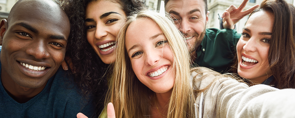 Stock photo of young people taking a selfie from freepik.com