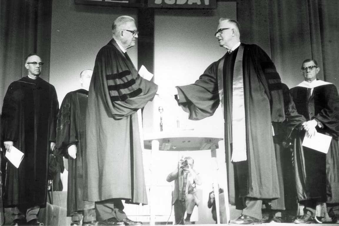 Bishops from The Methodist Church and Evangelical United Brethren Church join hands as The United Methodist Church is formed. Photo courtesy of United Methodist Commission on Archives and History.