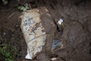 A Bible coated in mud lies outside Fenwick (W. Va.) United Methodist Church following heavy flooding. Photo by Mike DuBose, UM News.