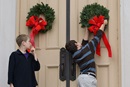Children hang wreaths on the sanctuary door at Belmont United Methodist Church in Nashville, Tenn., during the church's annual Hanging of the Greens service. Photo by Mike DuBose, United Methodist Communications. 
