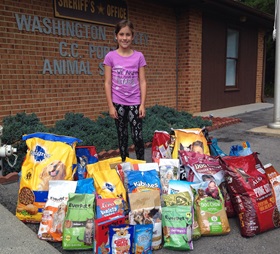 Marley Jane Musser collected about 30 bags of food for the Washington County C.C. Porter Animal Shelter. Photo courtesy of the Musser family. 