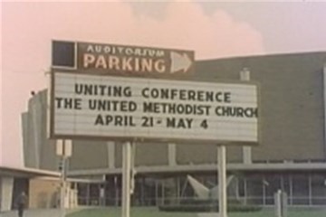 Image from film shows the marquee outside the Dallas Convention Center during the 1968 Uniting Conference.