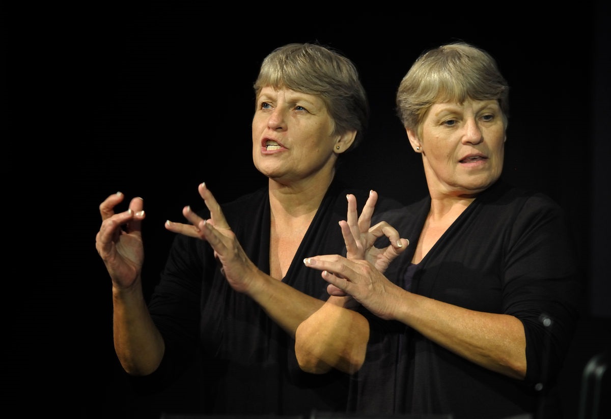 Betty Ostrom provides American Sign Language interpretation at the 2012 United Methodist General Conference in Tampa, Florida. Ostrom is a member of Pine Castle United Methodist Church in Orlando. A double exposure for UMNS by Paul Jeffrey.