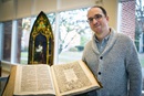 Archivist Brian Shelter shows a rare first edition King James "He" Bible in the Drew collection.