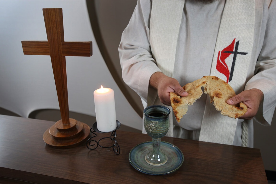 As we give the bread we have broken at the Great Thanksgiving as Jesus did at the Last Supper, we also say the words Jesus said. Photo illustration by Kathleen Barry, United Methodist Communications.