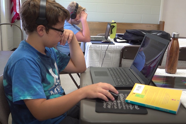 Neighborhood children attend a virtual school learning pod at Denton's Chapel UMC in Nashville, Tennessee