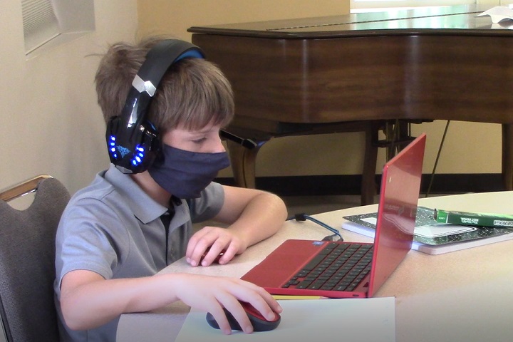 Neighborhood children attend a virtual school learning pod at Denton's Chapel UMC in Nashville, Tennessee