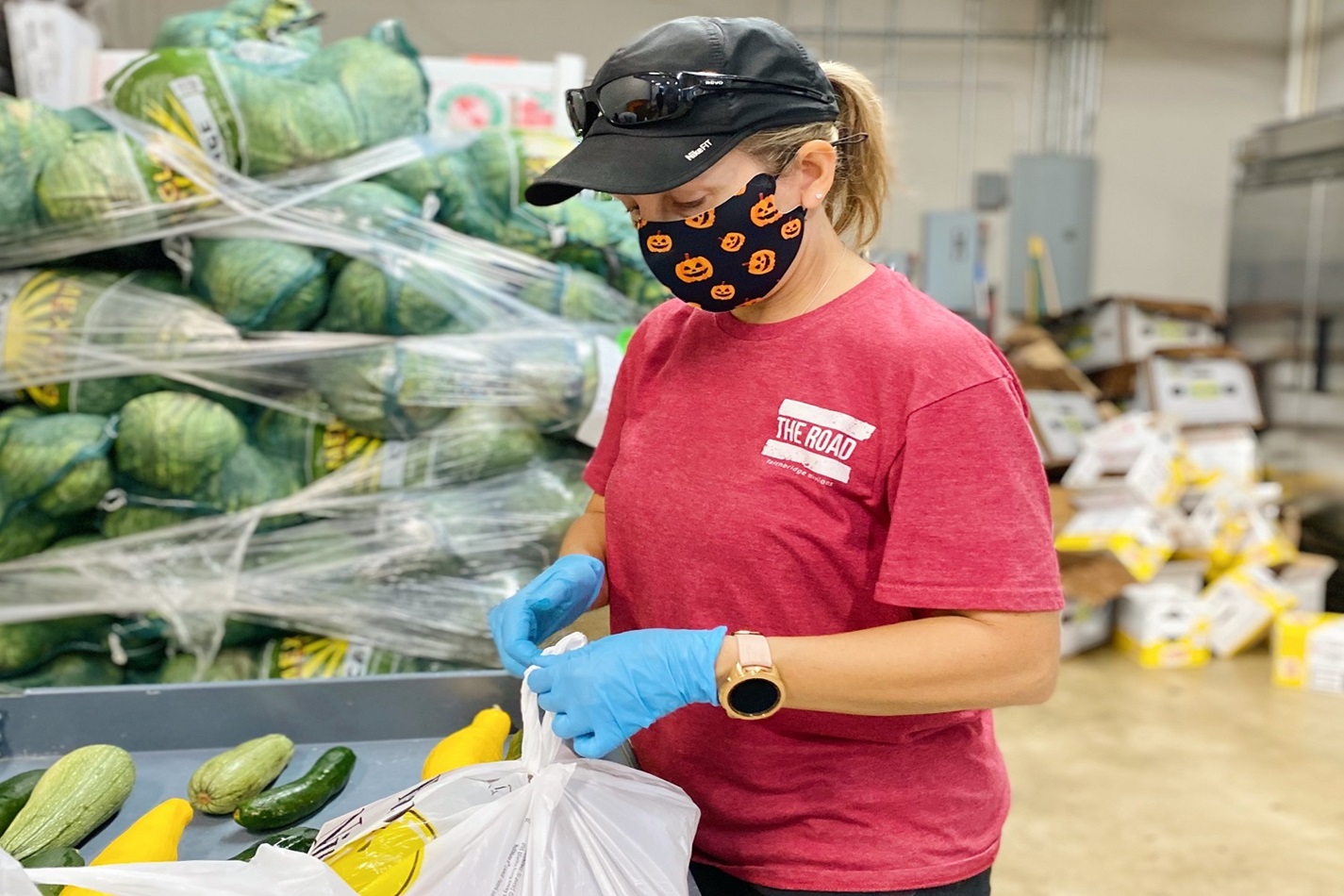 United Methodists, including Christy Sprague (pictured here), volunteer at Bridging For Tomorrow, a Houston community center, helping their neighbors, sometimes as many as 1,000 per week, receive food during the uncertainty of the pandemic.  Photo courtesy of Hannah Connor, Bridging For Tomorrow.