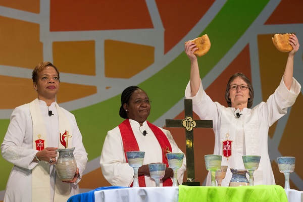 Bishops (from left): Bishop Tracy Smith Malone, Joaquina Filipe Nhanala and Sandra Steiner Ball consecrate the elements of Holy Communion during closing worship at the United Methodist Women Assembly 2018 in Columbus, Ohio. Photo by Mike DuBose, UMNS. The church today benefits greatly from the unique leadership of women in ministry who stand on the shoulders of our foremothers in faith. File photo of (left to right) Bishops Tracy S. Malone (l), Joaquina Filipe Nhanala, and Sandra Steiner Ball at the United Methodist Women Assembly 2018, by Mike DuBose, UMNS.