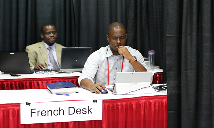 Isaac Broune and Joe Tueche Ndzulo handle the French desk during the 2016 United Methodist General Conference in Portland, Ore. Photo by Kathleen Barry, United Methodist Communications Kathleen Barry