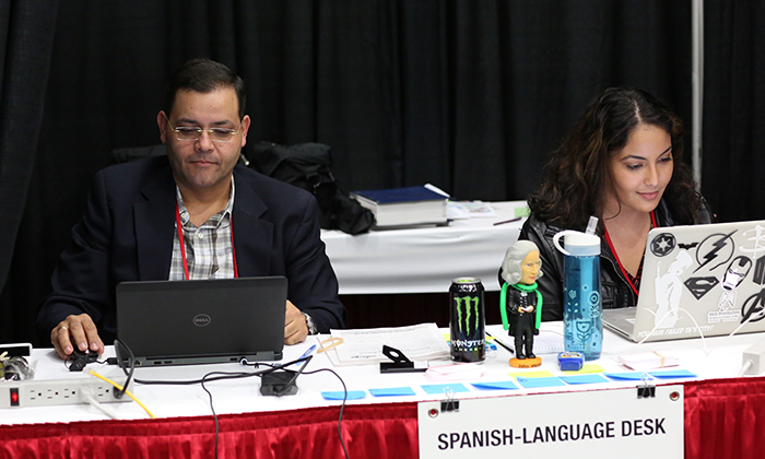 Gustavo Vasquez and Michelle Maldonado work at the Spanish-language desk during the 2016 United Methodist General Conference in Portland, Ore. Photo by Kathleen Barry, United Methodist Communications Kathleen Barry