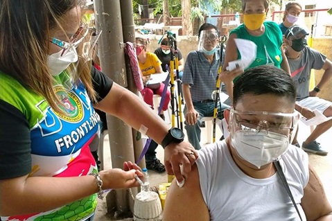 The Rev. Marvin Sulayao De Leon of Manena United Methodist Church in Bulacan, Philippines, receives a COVID-19 vaccine at San Miguel Bulacan Vaccination Center. United Methodists in the Philippines have worked with the government to fast-track vaccinations for church leaders, who are not categorized as front line workers, so that their ministry with the community can continue safely. Photo courtesy of Glessie Yambot De Leon.