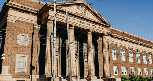 Cory United Methodist Church in Glenville, Cleveland, Ohio. The cornice above the pillars bears a message written in Hebrew, a vestige of its earlier life as a synagogue. PHOTO: VENTURA MEDIA, COURTESY CORY UMC