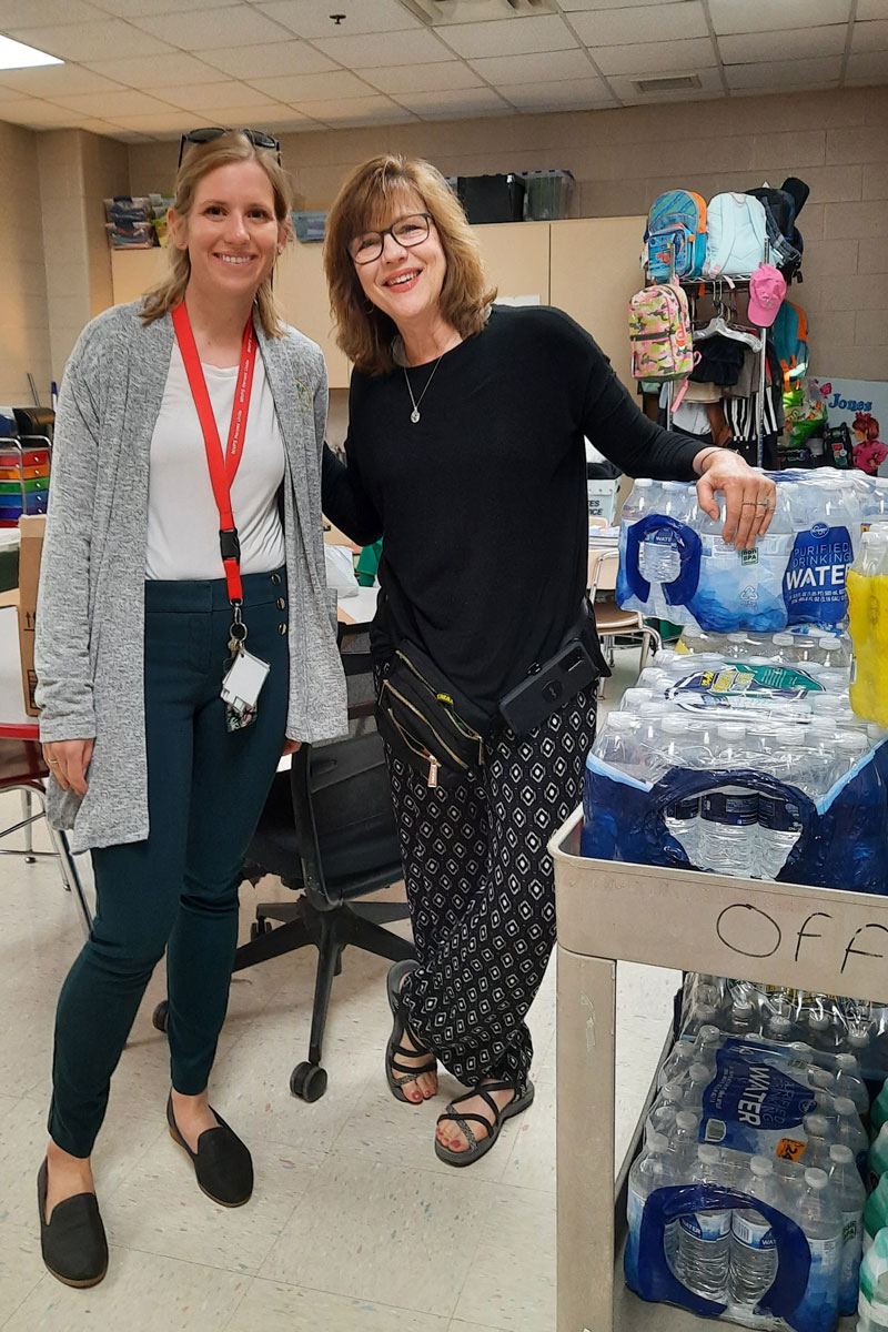 Julie Bollinger (l) and Carole Scates (r) of Hickman Elementary School, pose with some donations from Connection United Methodist Church, Nashville, TN. Photo courtesy Connection UMC.