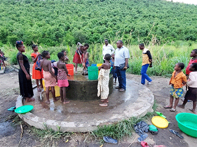 Women arrive to collect water from a well that has been tested and treated for contaminants by the North Katanga United Methodist Health Board. PHOTO: Courtesy of North Katanga UMC Health Board.