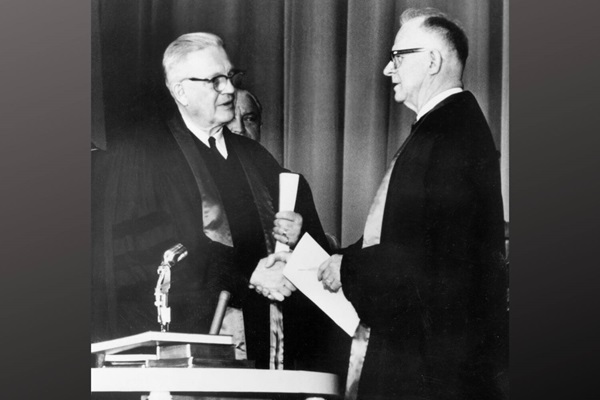 Evangelical United Brethren Church Bishop Reuben H. Mueller (left) and Methodist Bishop Lloyd C. Wicke join hands on April 23, 1968. Evangelical United Brethren Church Bishop Reuben H. Mueller (left) and Methodist Bishop Lloyd C. Wicke join hands on April 23, 1968.