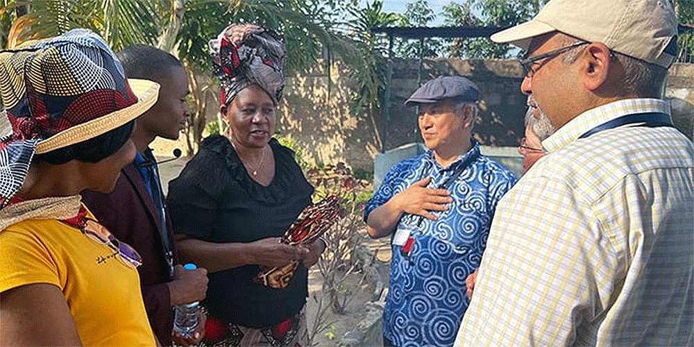 Bishop Hee-Soo Jung (blue shirt) and Roland Fernandes of the United Methodist Board of Global Ministries (tan hat) meet with leadership of the Center for Girls with Need in Matola City, Mozambique. The agency’s board gathered April 20-22 in Maputo for its spring meeting. Photo by Susan Clark, Global Ministries