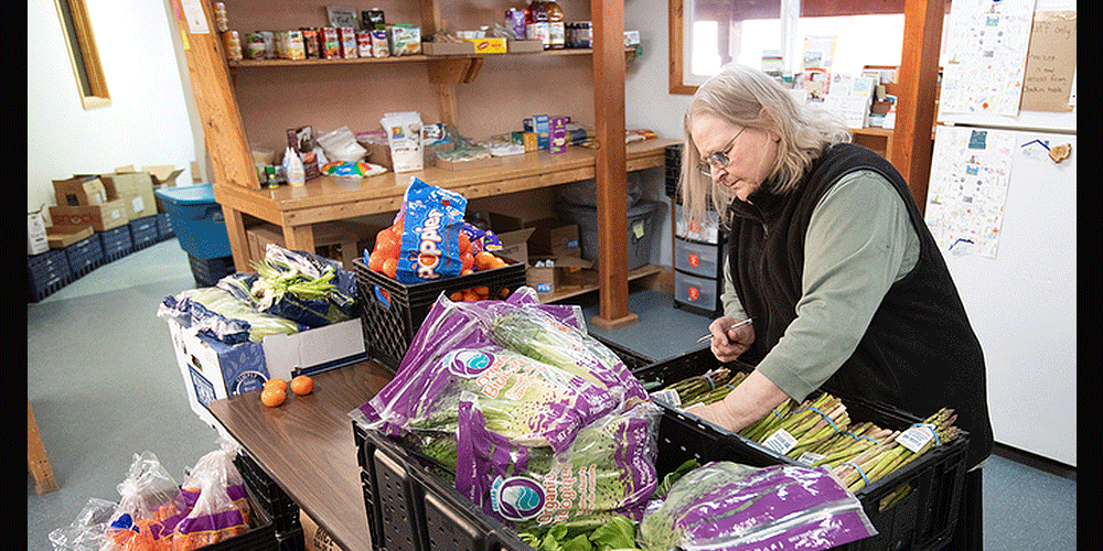 Ola Williams sorts through donated produce at the Willow Community Food Pantry in Willow, Alaska. Williams serves as director of the pantry, a ministry of Willow United Methodist Church.