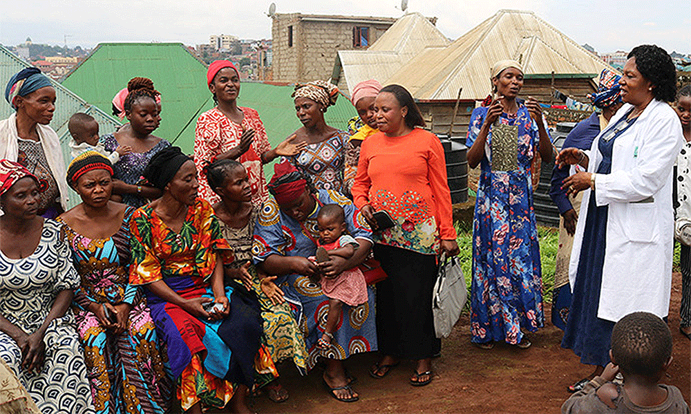 Women and children gather outside United Methodist Irambo Health Center in Bukavu, Congo, to hear from Dr. Marie Claire Manafundu (right), who coordinates the church’s Maternal and Child Health Program in eastern Congo. With funding from the United Methodist Board of Global Ministries, the church supports a program for more than 100 women living with HIV in the Kivu Conference. Photo by Philippe Kituka Lolonga, UM News.