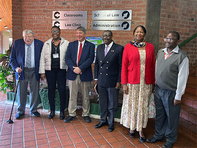 From left, Warren Plowden, Africa University acting dean Linet Sithole, Kent Fulton, N. Oswald Tweh, Lidia Gulele and Africa University Professor Christopher Munguma take a group photo after Judicial Council members Plowden, Fulton, Tweh and Gulele visited a class at the university’s law school in Mutare, Zimbabwe. Five other members of the Judicial Council, all United Methodist clergy, visited the university’s theology school. Photo courtesy of Africa University.