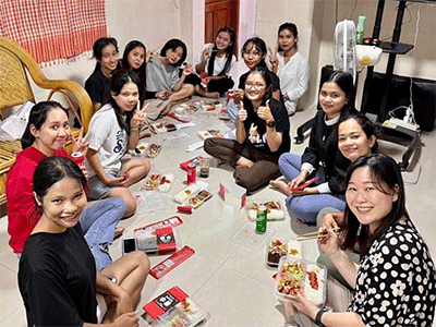 Students at Susanna Wesley House dormitory enjoy a meal together to celebrate graduating students. Missionary Janice Lee is pictured in the bottom. (Photo: courtesy of Janice Lee)