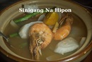 image shows a bowl of sinigang soup with shrimp