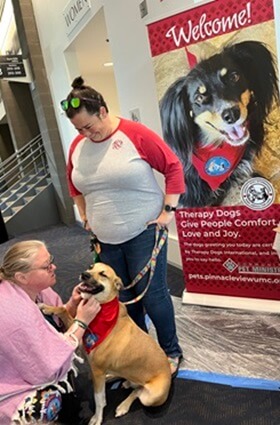 A therapy dog station was set up at the Arkansas Annual Conference to offer comfort and joy to delegates and attendees. Photo courtesy of the Community Pet Ministry at Pinnacle View UMC.
