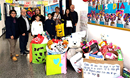 Missionary Luis de Souza Cardoso (second from left) and a group of students and teachers from Crandon Salto school displaying toys collected for a giving project for children in a nearby neighborhood. (Photo: Courtesy of Crandon Salto school)