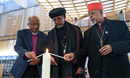 Ethiopian church leaders light a candle - symbol of common unity in Christ at the chapel of the Ecumenical centre:  Rev. Dr Yonas Yigezu Dibisa, president of the Evangelical Church Mekane Yesus, H.G. Archbishop Petros, general secretary of the Holy Synod of the Ethiopian Orthodox Tewahedo Church; and H.E. Cardinal Berhaneyesus Souraphiel of the Ethiopian Catholic Church.  Photo:  Ivars Kupcis/WCC