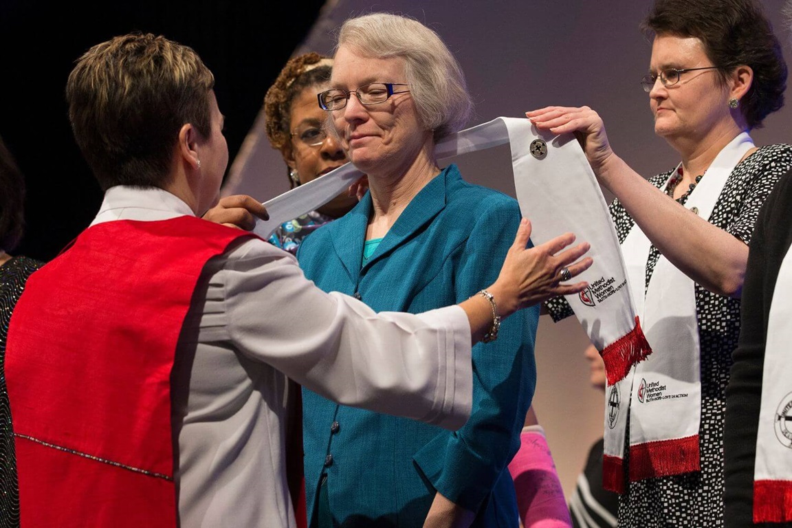 Jerrie E. Lindsey (center) is consecrated as deaconesses in the United Methodist Church by Bishop Cynthia Fierro Harvey (left), Deaconess Becky Louter (right) and Yvette Richards of United Methodist Women during the United Methodist Women's Assembly at the Kentucky International Convention Center in Louisville, Ky. Photo by Mike DuBose, UMNS