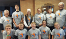 The United Methodist Youth Group at "Trick or Treat So Others Can Eat" sporting their new youth group t-shirts to make them easily identifiable within the community. Pictured, back row: Pastor Cheryl Nymann, Tristen Host, Tayah Anderson, Emmy Newsam, Easton Newsam, Kent Nyman. Front row: Bennett Kinsley, Weston Anderson, Royce Newsam, Maggie Dowling, and Julia Kinsley.