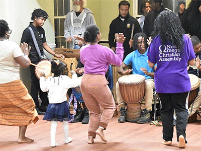 Unity Community dancers and drummers practice in a large, renovated room upstairs at the Imani Community Fellowship Church every Wednesday night. Photo by John Coleman.