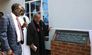 Bishop Eben K. Nhiwatiwa (right) dedicates the new United Methodist Chitenderano Church sanctuary, which was built in partnership with Union United Methodist Church in South Carolina and Home Is Best, a group of former Chitenderano church members now living in other countries. Edward Mukoyi (left), Chitenderano lay leader, reads a plaque during the Sept. 24 dedication in Rusape, Zimbabwe. Photo by Kudzai Chingwe, UM News.