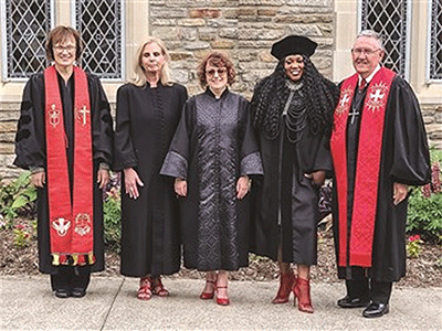Williams (second from right) is pictured with her class on  ordination day in June 2023.