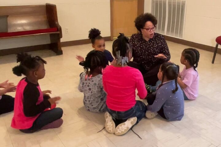 Quatrece McKinney volunteers with children at Community Care Fellowship in Nashville Tennessee