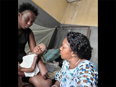 Dr. Marie-Claire Manafundu (right) examines Crispin, age 2, at Mangobo Methodist Hospital Center in Kisangani, Congo. Crispin is among the malnourished children in Eastern Congo who are receiving nutritional supplements and medical care as part of the Maternal, Newborn and Child Health program of The United Methodist Church. Photo courtesy of the Health Department of the United Methodist Church in Eastern Congo.